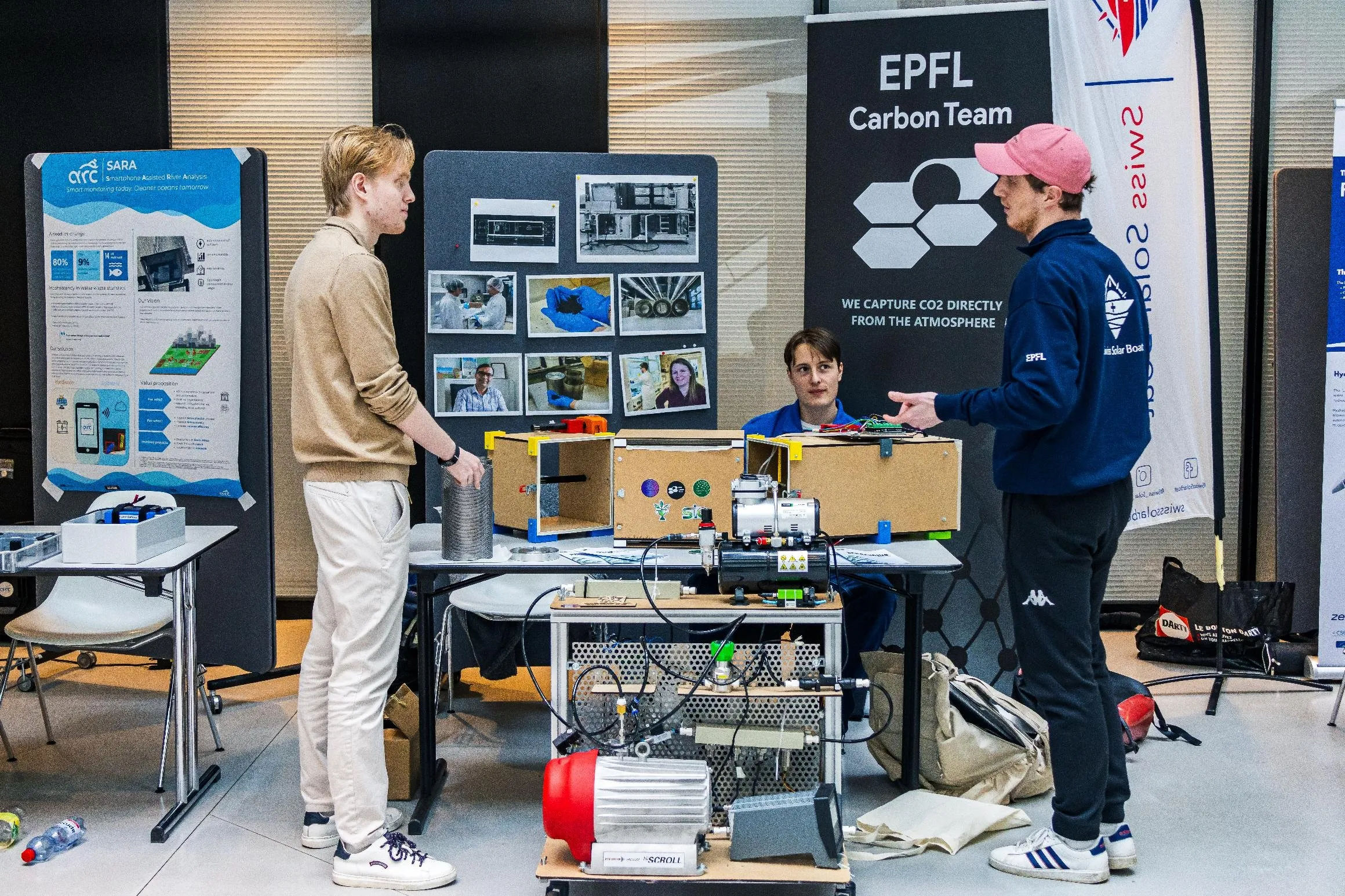 Carbon Team members presenting the prototype to visitors at a stand